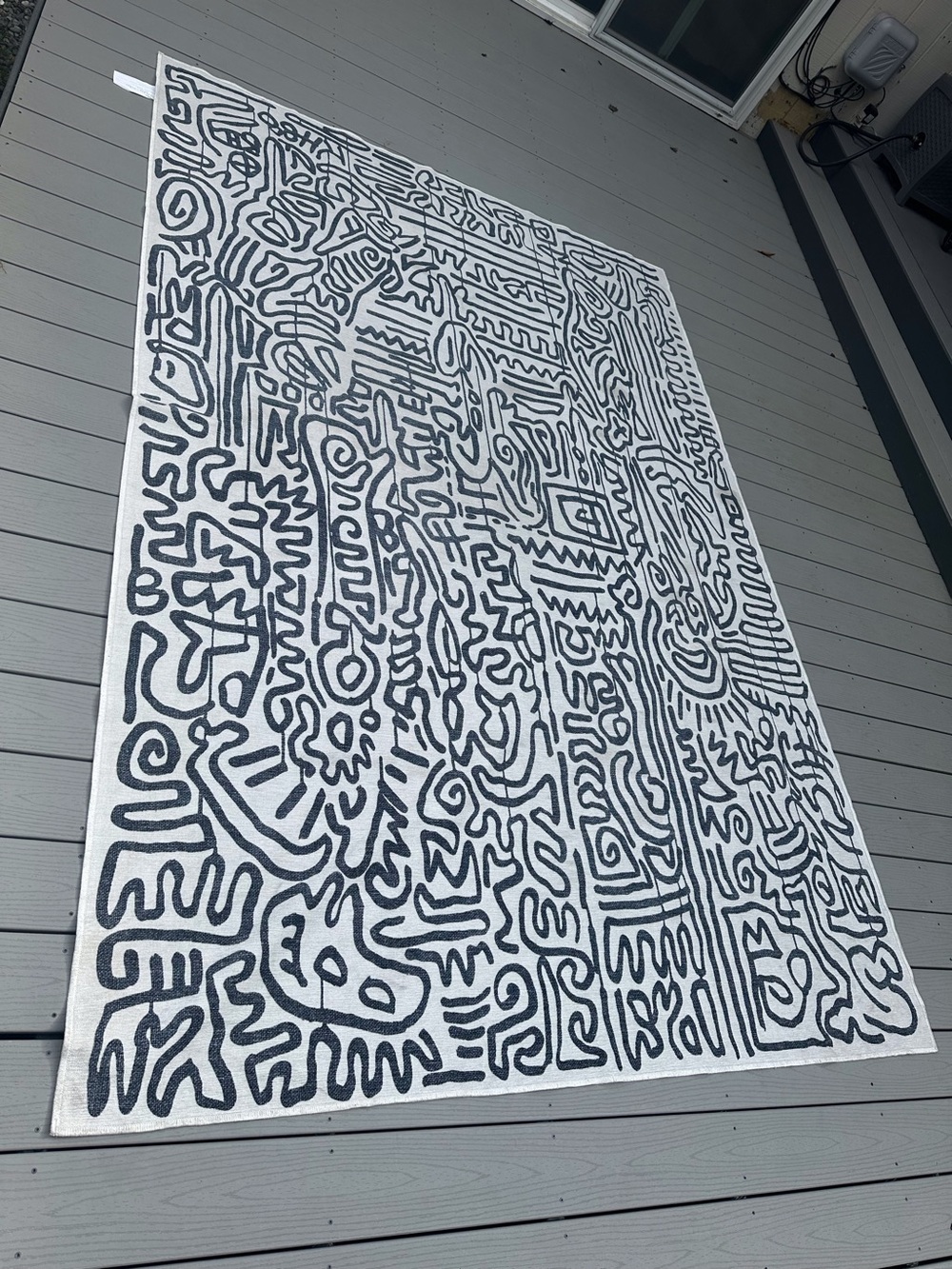 Selling a 9'x6’ Ruggable rug cover featuring the iconic Keith Haring black-and-w